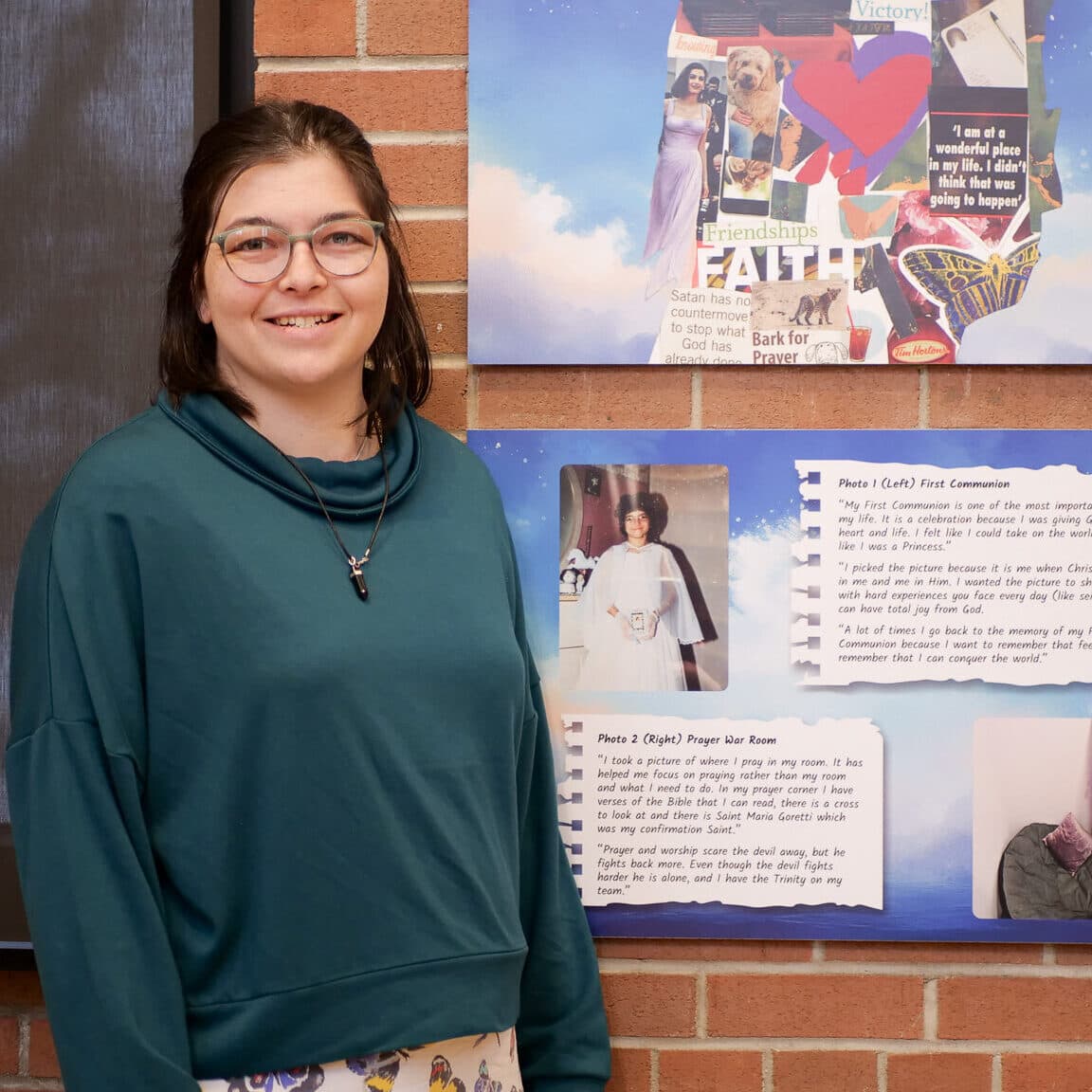 Daniela stands with her artwork.